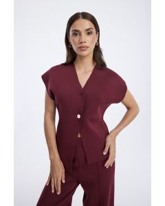 توب نسائيةبدون أكمام بزر أمامي